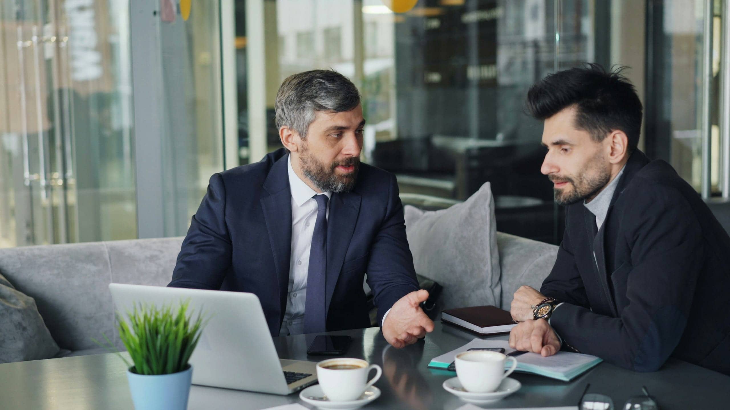 A strategic hiring discussion between two professionals