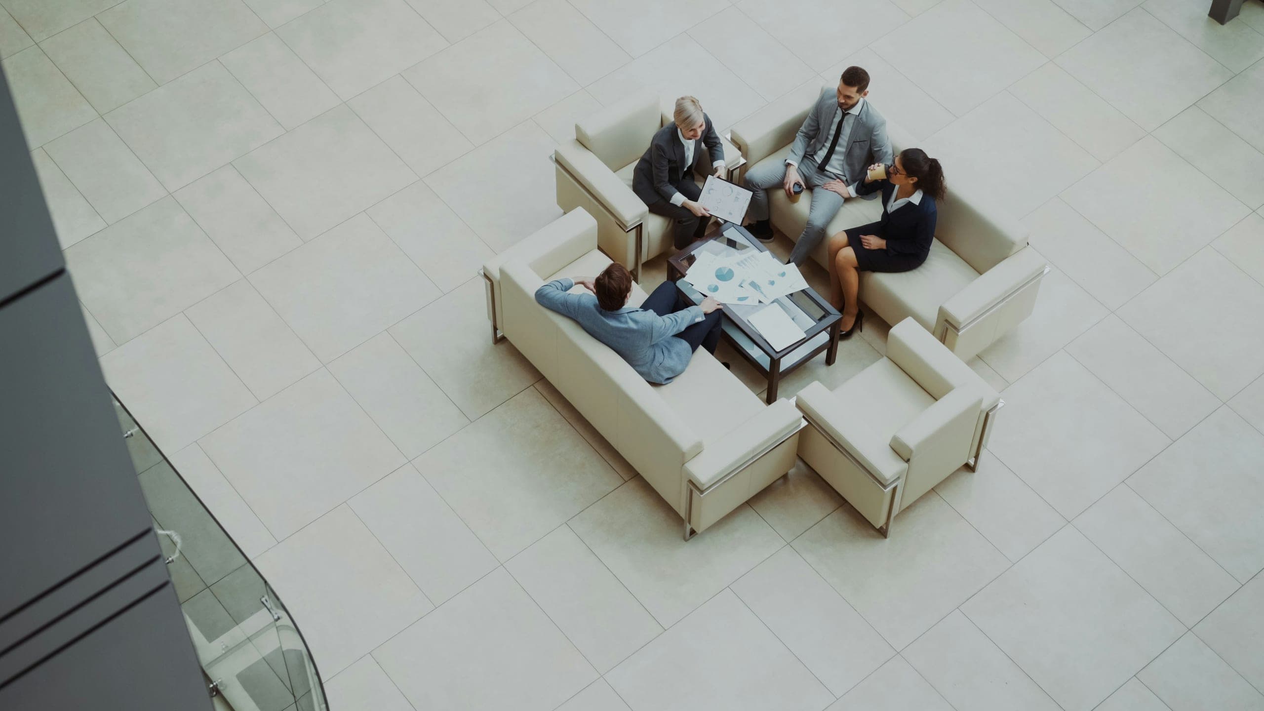 Legal professionals in consultation around a meeting table